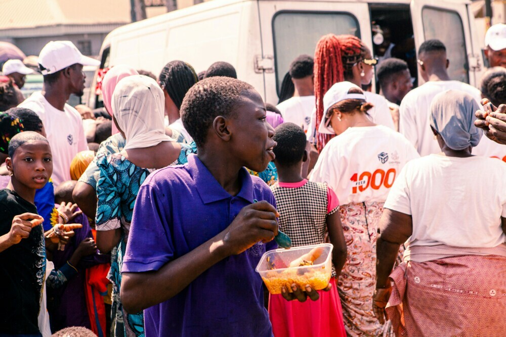 Image of a community outreach program organise by the stakeholders and donors seeing feeding the poor children.